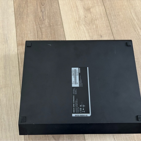 Black Xbox Console and black monitor